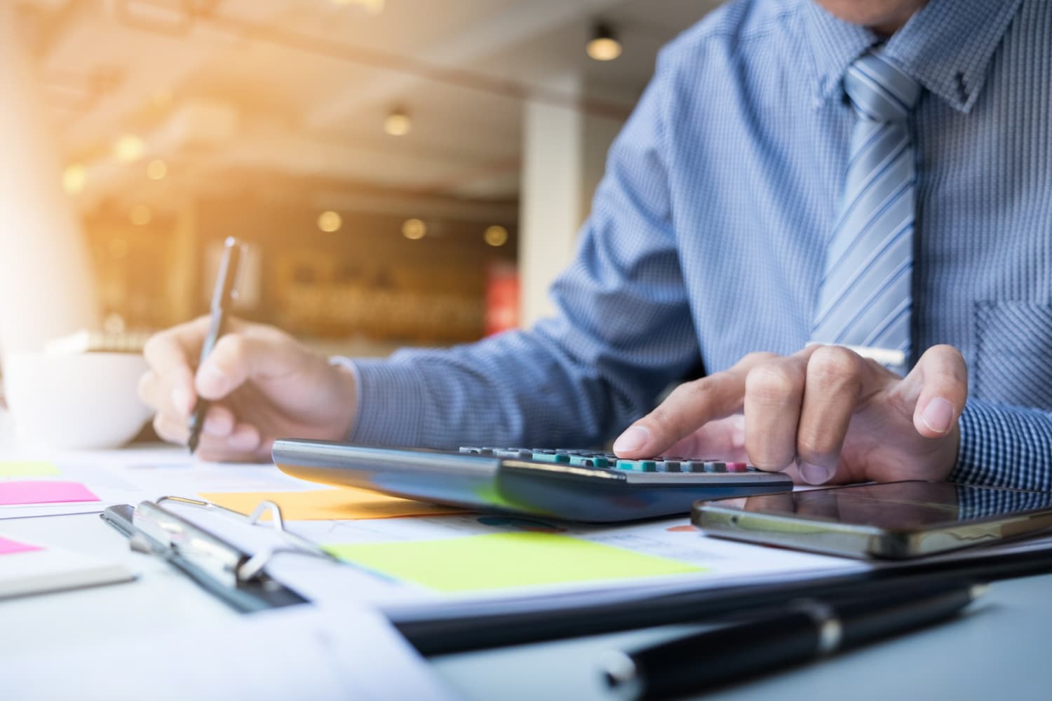 Accountant working with calculator